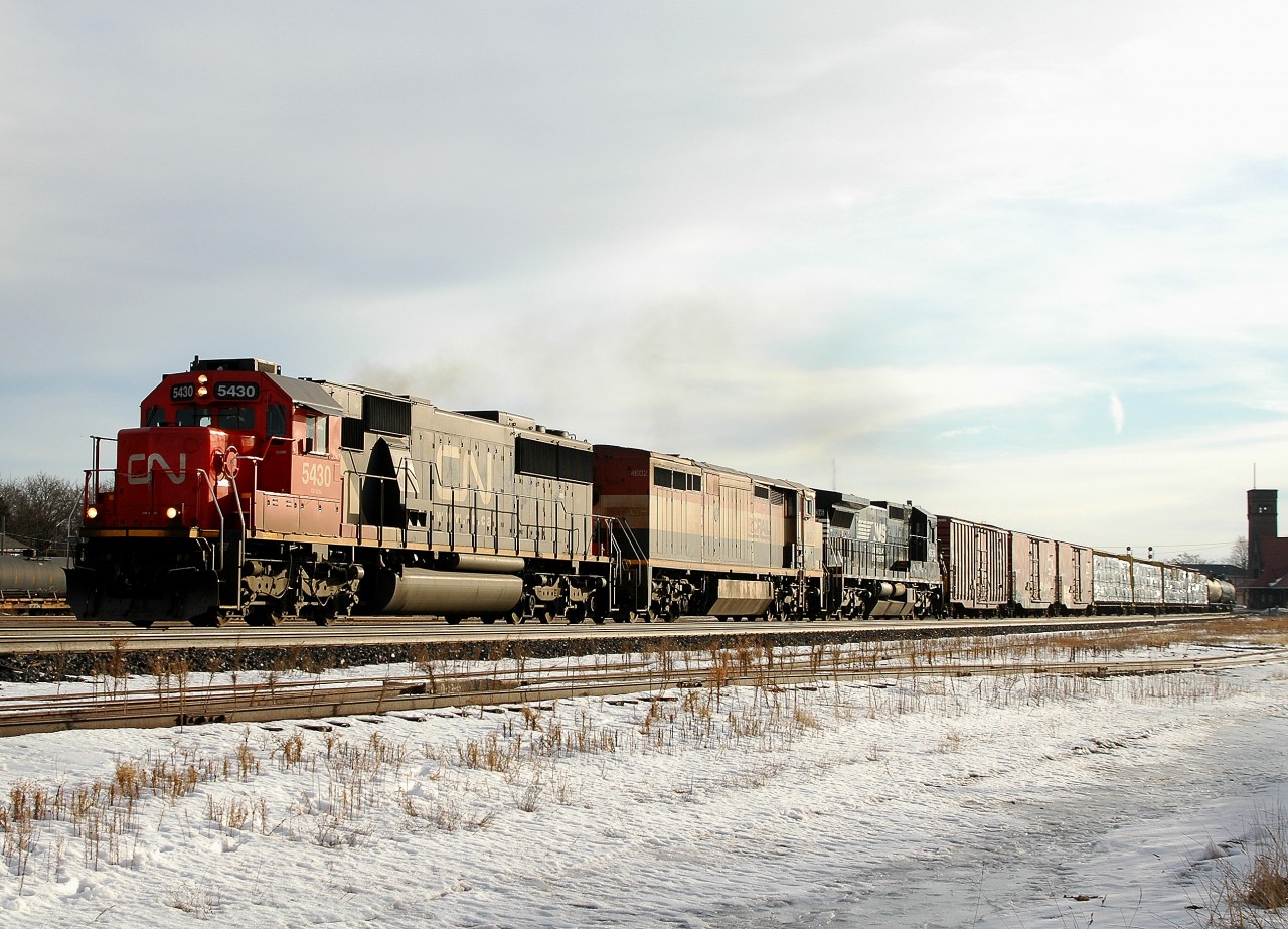 A late running CN 385 passing brantford with CN 5430 - BCOL 4602 - NS 8736 and 151 cars