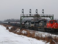331 with CN 8857 - NS 1055 pull under the signal bridge at Paris West with a 63 car lift