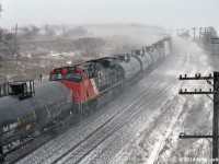 I love winter. On days when it snows sideways and flying ice pellets sting your face, I can't think of a better time to photograph trains... pra-praprapra. CN 2255 as the DPU on train 376 at Lovekin. 1427hrs.