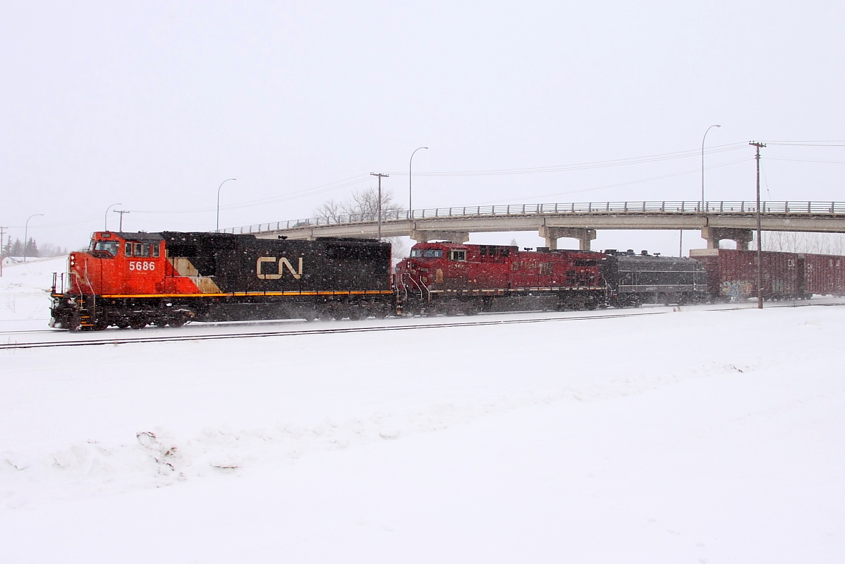 CN 5686 leads CP 9500 and F unit RPCX 6311 through Portage. The F unit is all likely heading for a museum somewhere in western Canada.