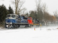 Light snow is falling as one of CN's latest acquisitions still in EMD demonstrator paint leads train 331 at Copetown, ON.