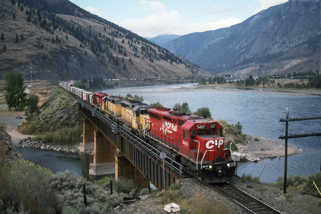 A rare combination especially for the "West."  2 MK rebuilt SD45's (SD40R) leads a pair expatriated UP SD40-2's across a tributary of the Thompson River.  Unfortunately, these days are gone..  Now legions of GE's have taken up the task.