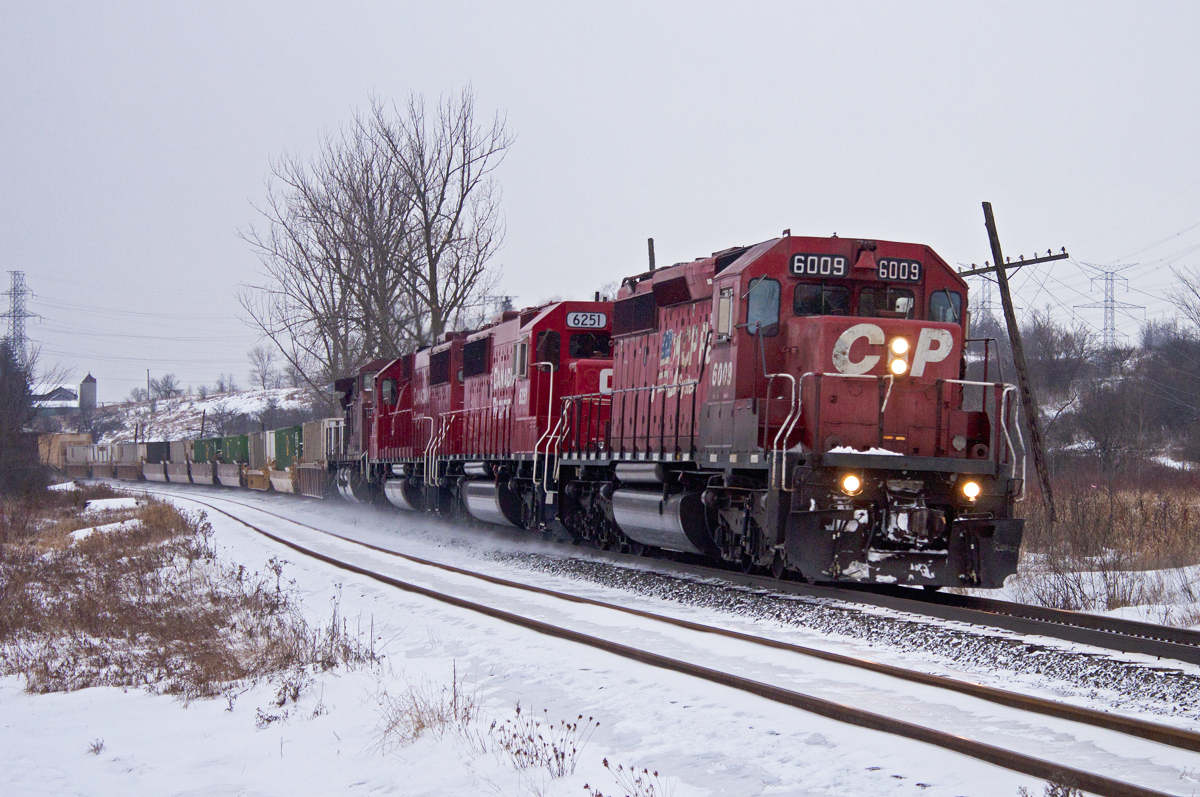 After rotting on the main at Neilsons for almost three hours, CP 240 finally makes its way out of Toronto for their trip to Smiths Falls. Consist is 6009-6251-6241-9593.