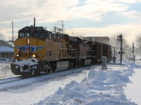 With the short days of winter and working full-time I rarely get a chance to make it trackside anymore before nightfall, and even more rarely get a decent train the cooperates with my schedule. Fortunately things worked in my favour today and just as I was finishing work I got word of a Union Pacific leading an Eastbound, so after a quick dash home to grab my camera and back to the tracks I set up my shot just barely making it before the train. Talk about luck! The only unfortunate part of the whole situation is the terrible afternoon winter light that is trying its hardest to ruin my shot.