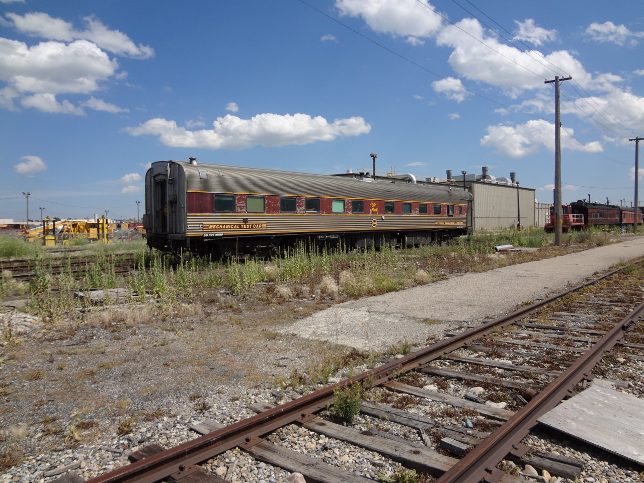 MECHANICAL TEST CAR (VOITURE D'ESSAIS MECHANIQUE) CP 66 sits on the dead line at the Ogden shop complex waiting its fate along with a plethora of other work service and business cars on this warm July afternoon in 2012.

CP business cars Lacombe, Shaughnessy and Assiniboine, baggage cars CP 404910 and CP 404937, sleepers IC&E 2458 Pine Leaf and IC&E 2460 Pine Island (ex-AMTRAK), and freshly painted ex-AMTRAK day coaches CP 103 and 104 were scattered throughout the complex in various stages of repair and disrepair.