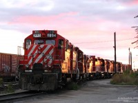 Resting on the "Diesel Spur" in between CP's sprawling West Toronto and Lambton Yards at Runnymede Road, a gang of road Geeps assigned to the Toronto area sit enjoying the sunset together, awaiting to be broken up and sent on the various regular local assignments and jobs. Maybe one pair goes to work the Emery Turn, maybe another is sent out on one of the Obico jobs, or a trip to Mississauga on the <a href=http://www.railpictures.ca/?attachment_id=9368><b><i>Streetsville Turn</i></b></a>, or a bunch left together to handle the Lambton Transfer to and from Agincourt.
<br><br> Tonight's lashup is almost-all GP9u, consisting of CP 8234, 8226, 8216, 8215, 3105 (a newer GP38-2), 8242 and 8203. Built in the 1950's by General Motors Diesel Division for road service, the 8200's were rebuilt and remanufactured in the 1980's for continued road duties - intended to handle roadswitcher and local work at division points across the system. Just over 5 years later, the literal depiction in this photo would turn figurative, as the sun sets on CP's once-mightly fleet of over 200 rebuilt GP7 and 9's. As of early 2014 they number just over 50 units, with ongoing retirements and scrapping to donate some components to brand new GP30C-ECO units currently being delivered.
<br><br>Of the old guard pictured, 8203, 8222 & 8234 are listed as Tied Up Unserviceable (likely soon to be retired), 8242 was retired and scrapped not too long ago, and units 8215 and 8216 still active in the Toronto area, for now. 3105, one of a large fleet of newer GP38-2 units built in the 80's (which are being overhauled at contract shops) has since migrated to Winnipeg.
