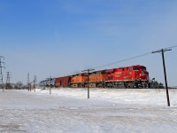 CP 8869 with trailing BNSF 4871 and 5183 charge eastward with train 608 at Tilbury on the CP's Windsor Sub.