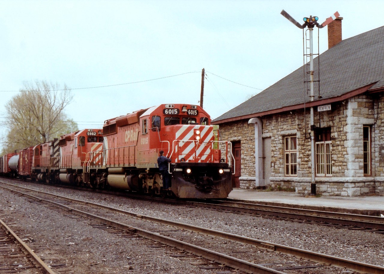 There is hardly a railfan out there that is not aware of all the flack regarding the demise of the CP Chalk River Sub this past couple of years. A considerable number of people think that the pulling up of this underutilized trackage is a big mistake. But it is gone. In better days, we see CP 6015, 5982 and 4244 with a westbound passing the classic old Renfrew station. I don't know the current status of this building, but it would be a real crime to let it fall into disrepair or demolish it.