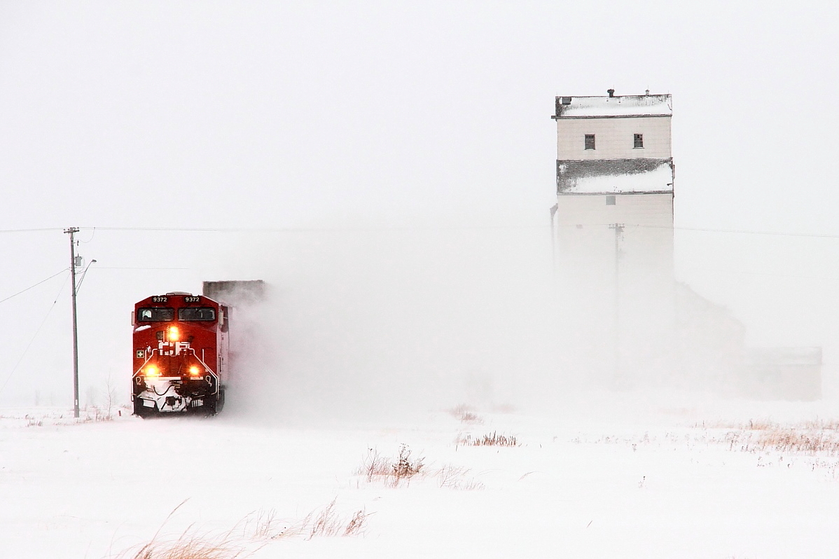 A westbound intermodal whips up the snow as it passes through Meadows.