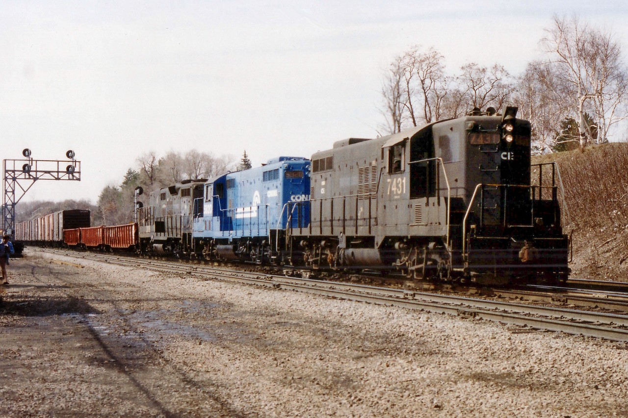 I have forgotten why a Conrail-powered train was out of TH&B Aberdeen Yard in Hamilton on this particular day, running at a time (1030 am)not all that common with the railroad; I wondered if it was a Toronto-bound "Starlight". CR 7431, 5820 and 3819, probably Canadian Division locomotives, power this train. Note the trailing unit does not have a cab.  (I had seen this loco on transfers at Fort Erie the odd time as well back then.) There were 76 cars, CP van 434062 on the tail and a smattering of surprised railfans around as well.