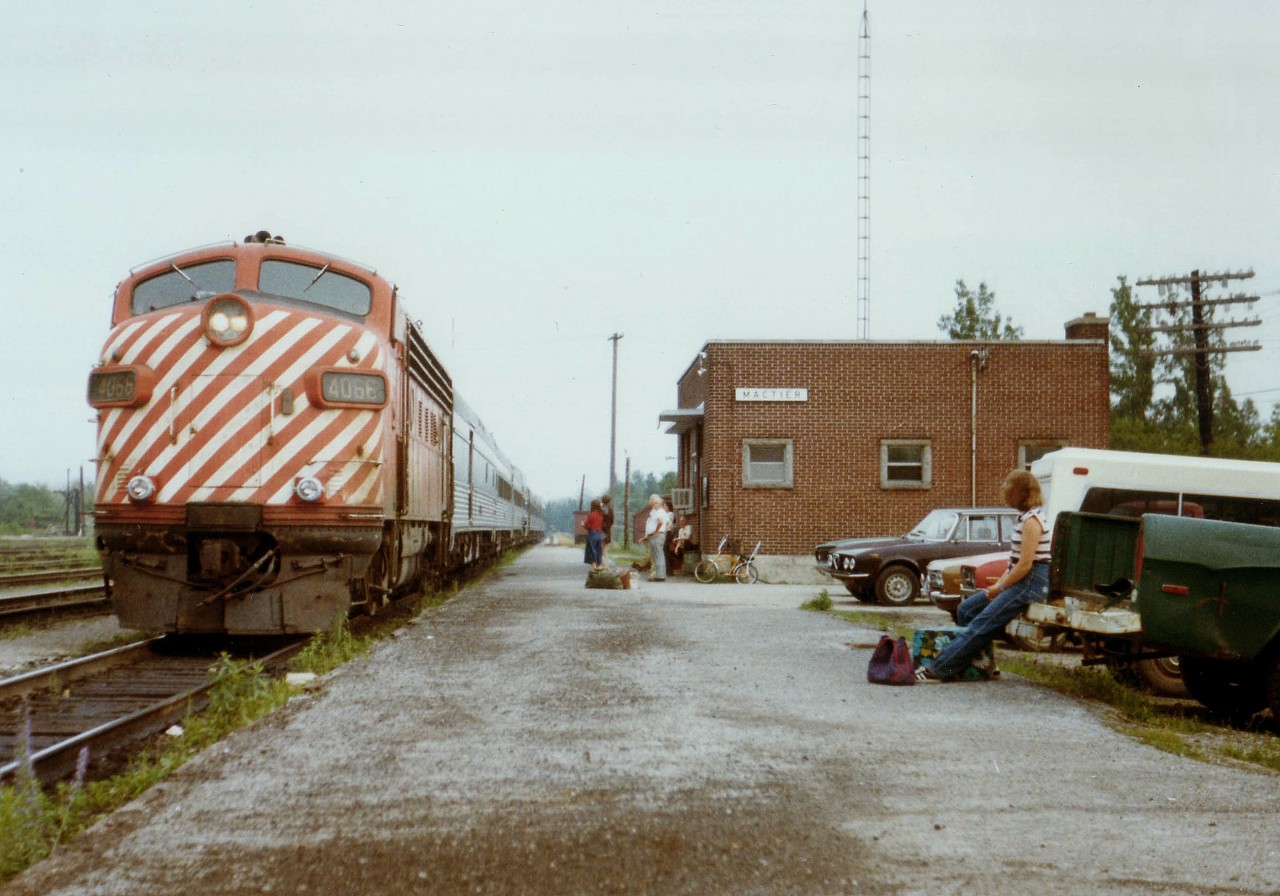 The Toronto portion of the westbound Transcontinental passenger train stops at MacTier CP station en route to a Sudbury Jct. meet with the Montreal portion of the train; where they will be combined for the trip to Vancouver. This particular loco was a rather frequent sighting on this train. The nondescript modern brick building is still there, unchanged, as the location is a CP crew change point.