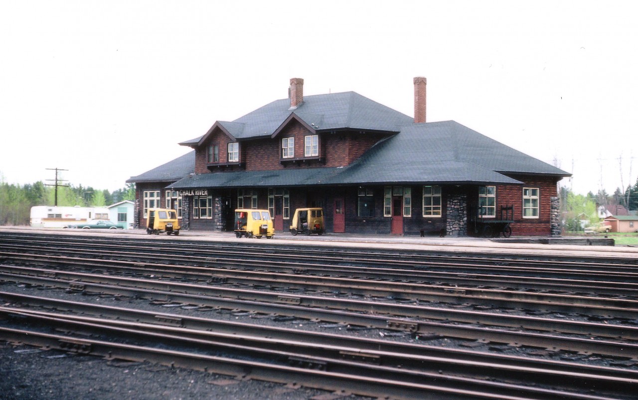Here's another of those historic old Rwy stations, this one one of the larger on CP. Once had a busy yard, turntable, and I am guessing, perhaps a crew change point. The railroad is gone, torn up in the past couple of years; makes me wonder if the station still stands, and if so, why. Hopefully the municipality can find some use for it, such as senior centre or meeting hall. All was quiet when I visited there for this image; but interesting to note the speeders out front. Track inspectors on coffee break?