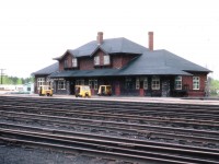 Here's another of those historic old Rwy stations, this one one of the larger on CP. Once had a busy yard, turntable, and I am guessing, perhaps a crew change point. The railroad is gone, torn up in the past couple of years; makes me wonder if the station still stands, and if so, why. Hopefully the municipality can find some use for it, such as senior centre or meeting hall. All was quiet when I visited there for this image; but interesting to note the speeders out front. Track inspectors on coffee break?