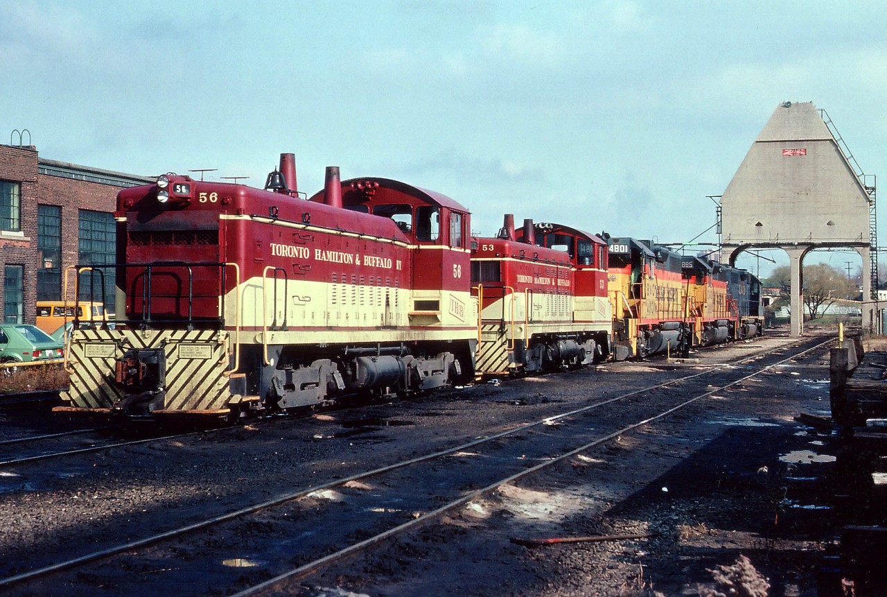 An afternoon view of power laying over at the TH&B Chatham St. shops. In the foreground, TH&B switchers 56 & 53, in behind a trio of GP38-2s for the "Nanticoke" steel train: Chessies: 4801, 3885 and 4828.