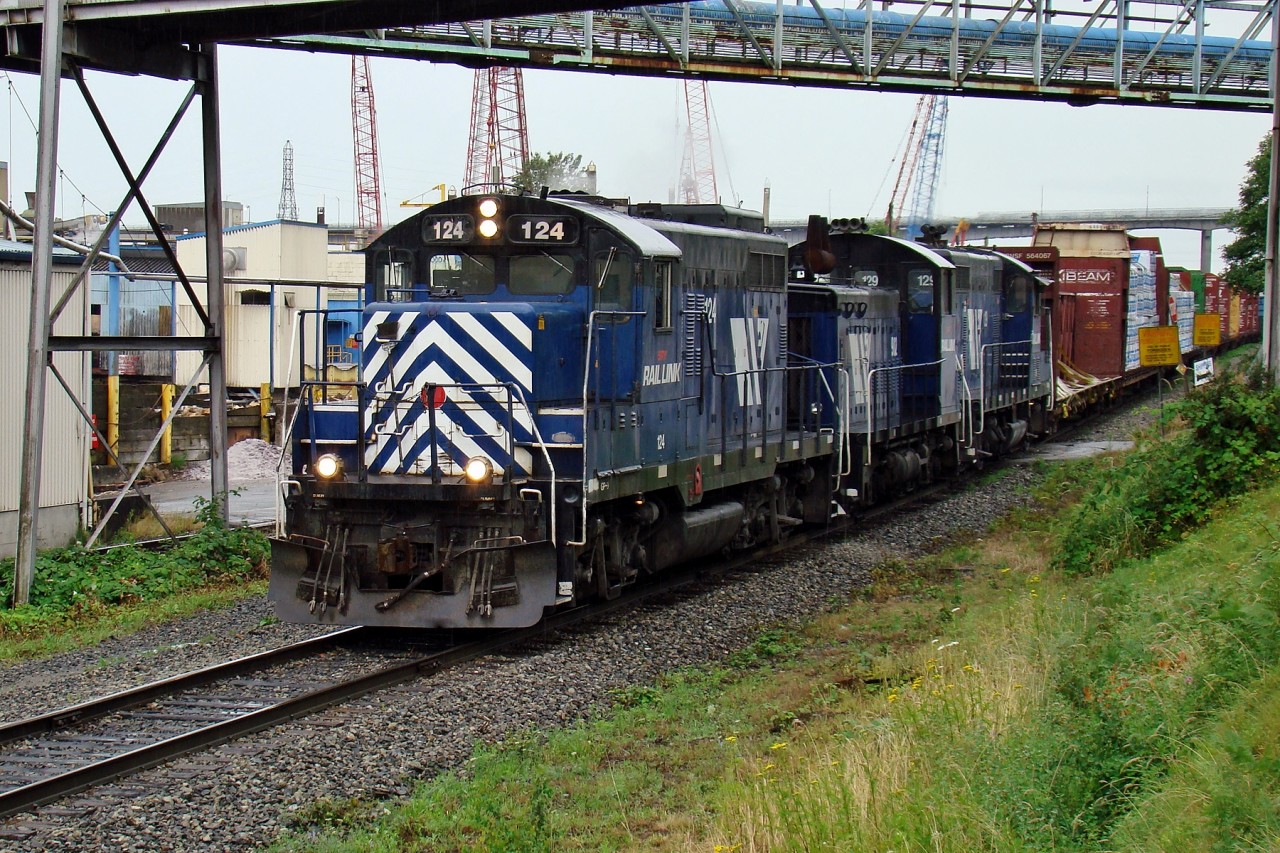 SRY GP9 124, SW900RS 902 and GP 129 head east on the Marpole Spur as they travel from Trapp Yard to New Westminster Yard.
