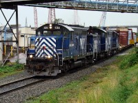 SRY GP9 124, SW900RS 902 and GP 129 head east on the Marpole Spur as they travel from Trapp Yard to New Westminster Yard. 