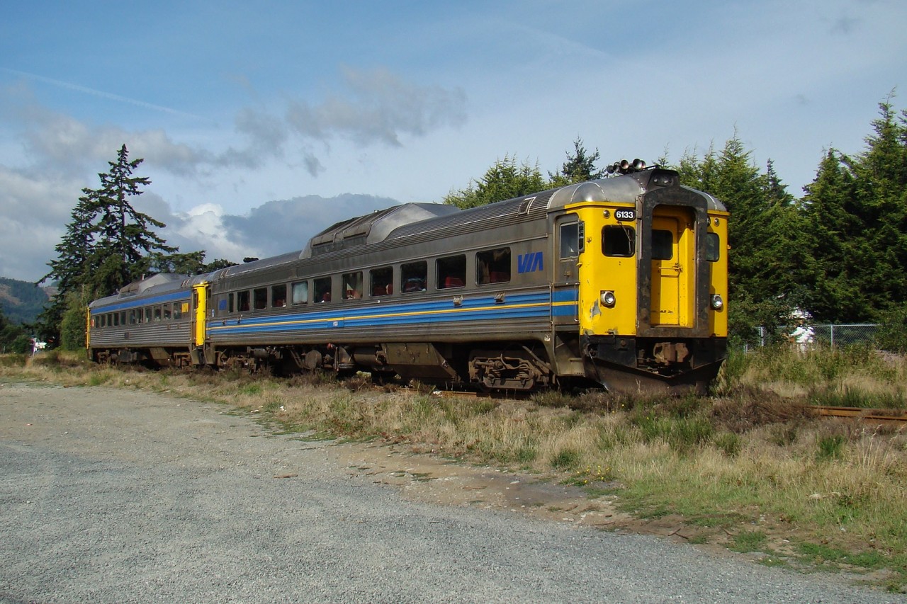 After completing their station stop in Langford, VIA RDC-1s 6133 and 6135 continue their northbound journey to Courtenay.