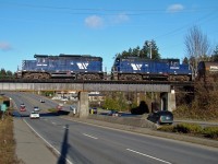 SRY GP-9's 110 and 119 cross the Trans-Canada Highway as they head for the junction with SRY's Victoria Sub