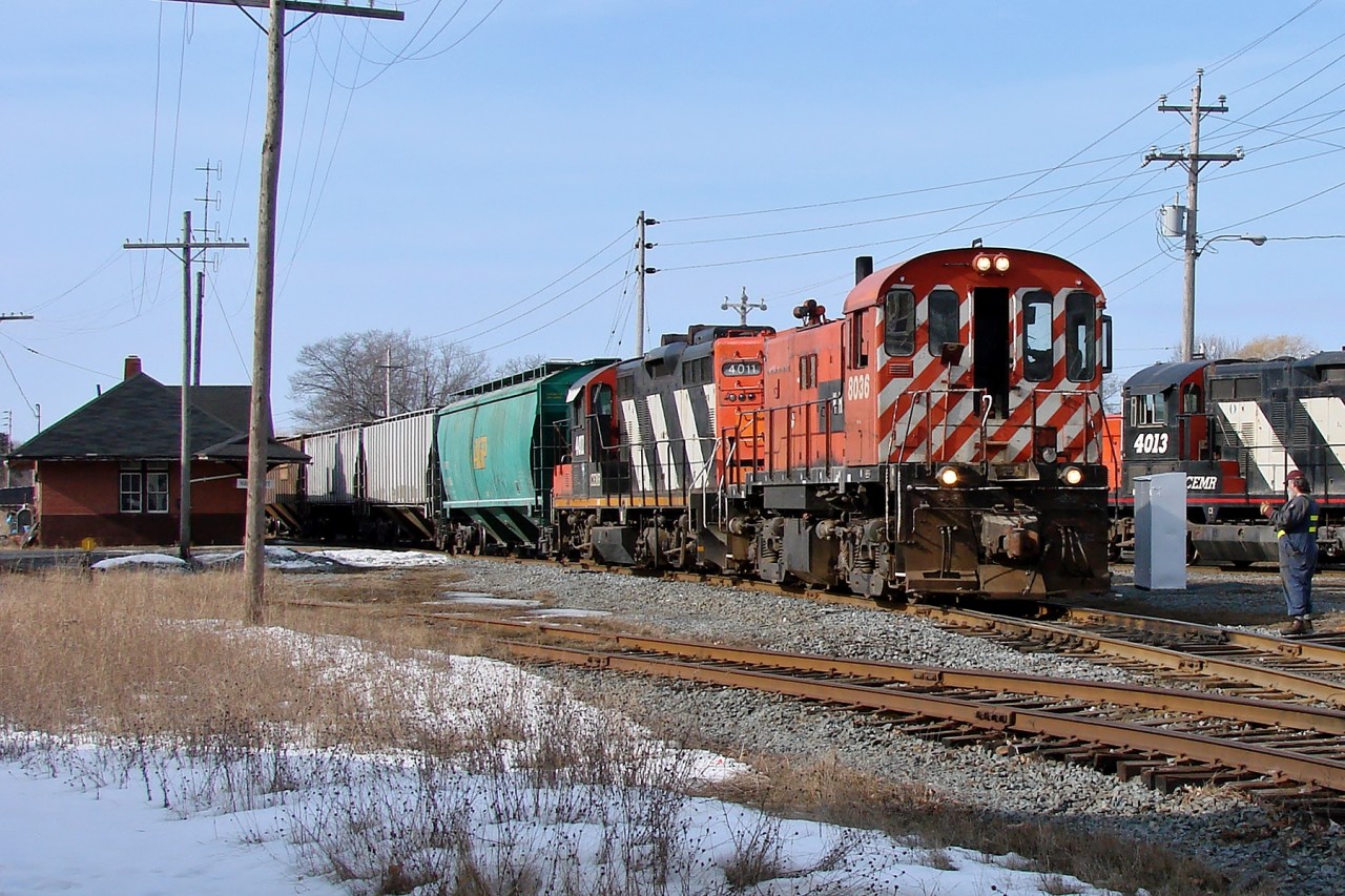 Windsor and Hantsport RS23 8036 and lease Central Manitoba Railway GP9RM 4011 lead a short freight out of the yard in Hantsport.