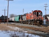 Windsor and Hantsport RS23 8036 and lease Central Manitoba Railway GP9RM 4011 lead a short freight out of the yard in Hantsport.