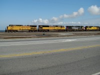AC4400CW 6689, SD9043MAC 8248, AC4400CW 6378, and AC440CW 6723 wait to unload their train at Westshore Terminals coal export facility.
