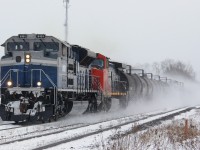 Just a few minutes after James Gardiner shot it at Brantford, 8101 and 2611 kick up snow as they speed by me at Powerline Road. Thanks also to Joseph Bishop for assistance in the chase from Copetown. With high horsepower and no work at Brantford or Paris, there was no safe bet as to where to catch this train, and I arrived at the crossing with only seconds to spare before the gates went down.