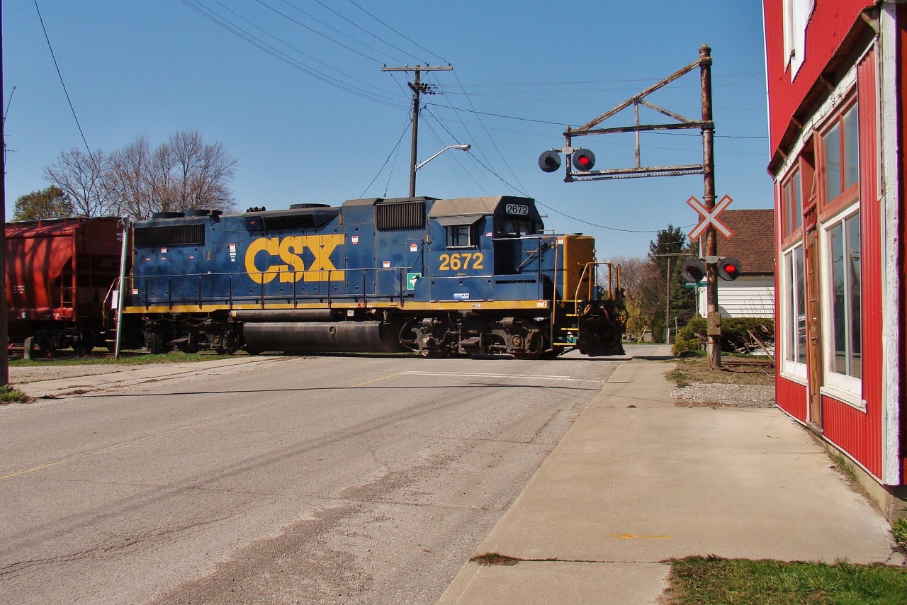 Just another day on the CSX in SW Ontario today as the Wallaceburg local heads east through Tupperville en-route to Dresden to run around their train. He will then return to town, switch the elevator here and drop a car in Wallaceburg.