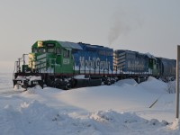 Mobil Grain sits at Delisle SK., waiting to proceed onto the CN Rosetown Sub. following a major snowstorm in the region. This train would travel east on the Rosetown Sub, via trackage rights to the CN Saskatoon yards.