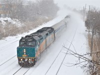<i><b>Two trains for the price of one!</b></i> There is so much snow in this photo it's hard to tell, but this is two VIA trains combined into one. Until Hervey Junction in northern Quebec, VIA 601 to Jonquière and VIA 603 to Senneterre run as a combined train. Each train has an F40, a stainless steel coach and a stainless steel baggage car. VIA 6437 is at the head end and barely visible two cars back is VIA 6446.