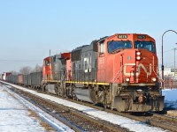CN 5675 & CN 2680 head east through Dorval with CN 310 on a mild and sunny winter morning. For more train photos, click <a href=http://www.flickr.com/photos/mtlwestrailfan/>here.</a>