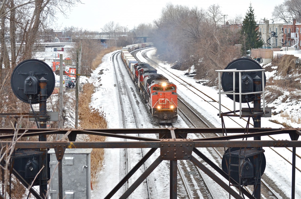 A slightly late CN 120 heads east with CN 8001 leading a Dash9 and another SD70M-2 through Montreal West. For more train photos, click here.