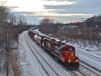 CN 7054 & CN 7277 head east with a transfer at sunset. At the tail end was about 50 empty well cars. A pair of GP9's is not something to take for granted.... though still easy to do in Montreal. For more train photos, check out http://www.flickr.com/photos/mtlwestrailfan/ 