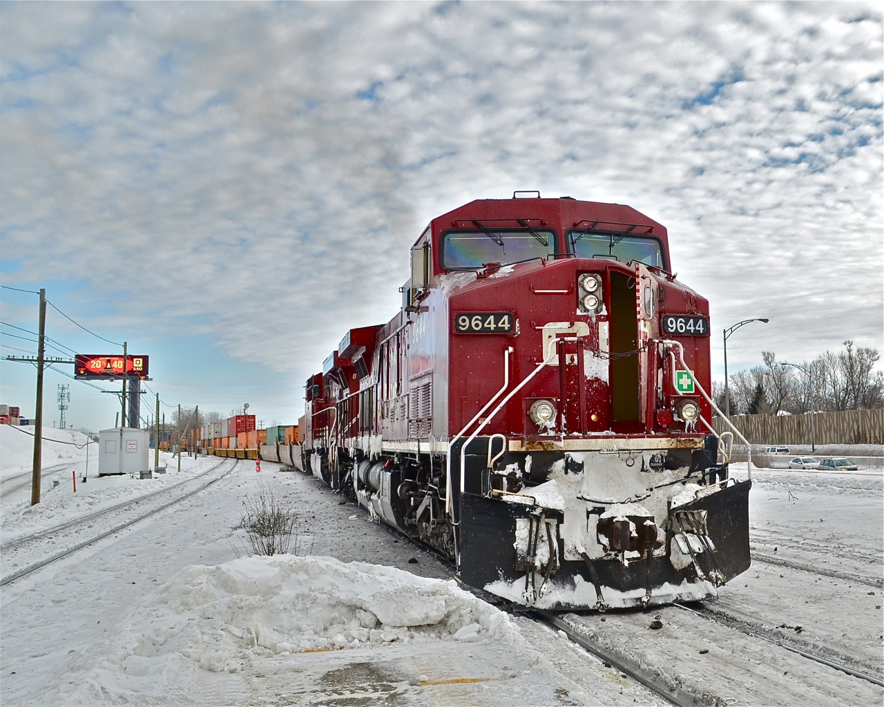 CP 9644 & CP 8760 do some switching at Lachine before heading westwards with a stack train. For more train photos, check out http://www.flickr.com/photos/mtlwestrailfan/