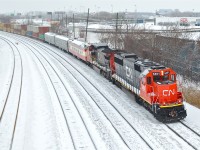 <b>CN mixed train!</b> CN 5451 (ex-EMDX 9008) & CN 2153 (ex-ATSF 836) lead CN 149 westwards after having switched 3 CN business cars ('Tawaw', 'Baton Rouge' & 'Louis Jolliet') onto the head end.  For more train photos, click <a href=http://www.flickr.com/photos/mtlwestrailfan/>here.</a>