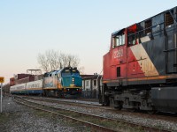 VIA 6451 leads a westbound past a stopped CN 308, which has CN 2260 and BCOL 4652 (out of sight). At this time CN 308 would regularly arrive here mid-afternoon and the train would be left crewless till early evening. A few months later, after the Megantic disaster, this practice would be discontinued. CN 308 now arrives in Montreal late at night, changes crews at Turcot west a few miles west of here and continues on its way. For more train photos, click <a href=http://www.flickr.com/photos/mtlwestrailfan/>here.</a>