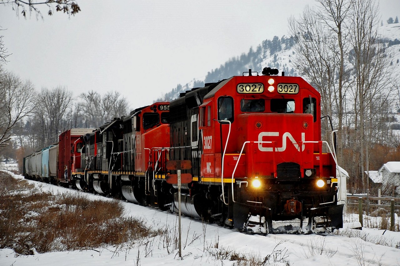 Snow is about to fall as CN(WC)3027 leads four units and eight wagons into Lavington. They will pick up a load of lumber @Tolko Industries and return to Kamloops later in the day.