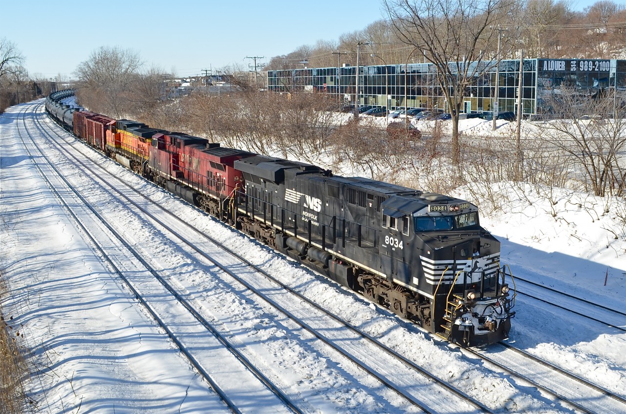Just before they added a CN unit..... NS 8034, CP 9500 & BNSF 4794 are heading east with a loaded oil train on a clear but cold day. They will stop in about half a mile and CN 8853 will be added as the leading unit. For more train photos, check out http://www.flickr.com/photos/mtlwestrailfan/