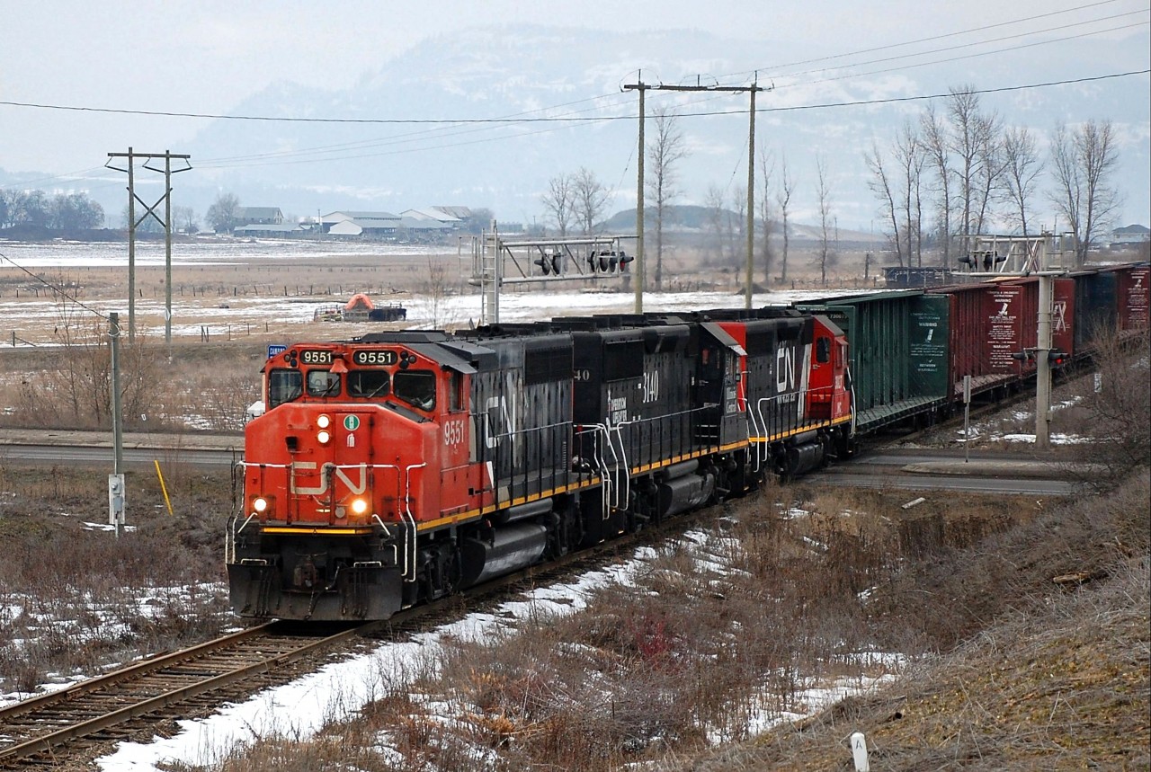 CN 9551,IC 3140 & CN(WC)3027 are crossing Hwy97 north of Swan Lake and heading south towards Vernon with the local pick-up freight.