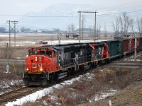 CN 9551,IC 3140 & CN(WC)3027 are crossing Hwy97 north of Swan Lake and heading south towards Vernon with the local pick-up freight.
