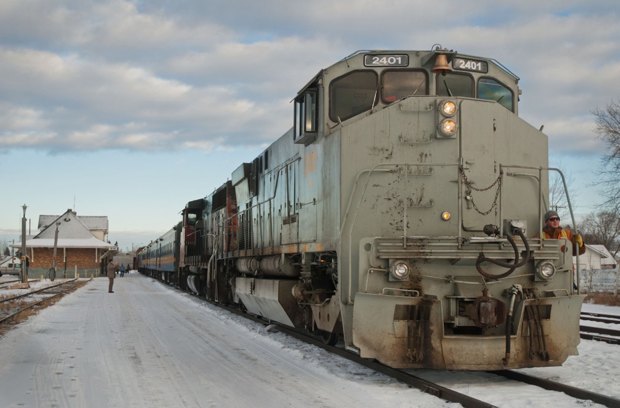 Keewatin Railway Company 2401 has just doubled three coaches and a baggage car from the shed track at left to the main line on top of some freight traffic from the HBRY yard. The 2401 (ex HBRY, SLQ, CN 3512) would then run around the train and trail behind HBRY GP40-2W 3005 on the trip north to Pukatawagan MB. I remember wondering to myself where all the passengers were, that question was answered when two vans labeled "Manitoba Corrections" arrived.