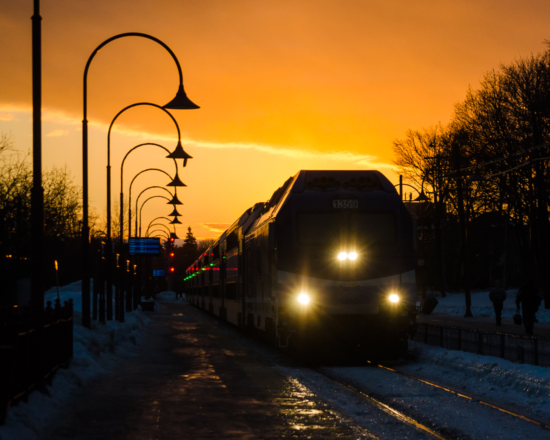 Under an orange sky. AMT 1359 leads a deadhead movement eastwards through Montreal West a few minutes before sunset, with a stunning sky evident in the background. For more train photos, check out http://www.flickr.com/photos/mtlwestrailfan/