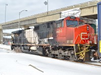 CN 2684 (the DPU on CN 308 which derailed in Plaster Rock, New Brunswick on Jan. 7th 2014) is heading to CAD (Canadian Allied Diesel) in Lachine, Quebec for much needed repairs. The crewmembers are operating the two GP9's (CN 4102 & CN 7017) which are pushing the train westwards via beltpack. Of note is that this spur which only serves one customer now (CAD) was once CN's main line to the west till a line relocation in 1960. For more train photos, click <a href=http://www.flickr.com/photos/mtlwestrailfan/>here.</a>