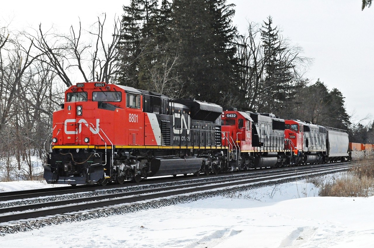 Underway again, CN 8801, 5432, and 5508 pause for 5508's crew to step off at Winston Churchill Blvd., where a taxi awaits.