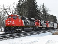 Underway again, CN 8801, 5432, and 5508 pause for 5508's crew to step off at Winston Churchill Blvd., where a taxi awaits.
