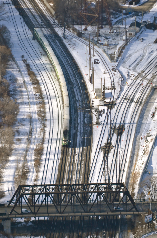 From the vantage point of the CN tower, we see an unknown MP40PH-3C lead an inbound GO Transit train towards the Bathurst Avenue bridge. In a few minutes the train will stop at Union Station. For more train photos, check out http://www.flickr.com/photos/mtlwestrailfan/