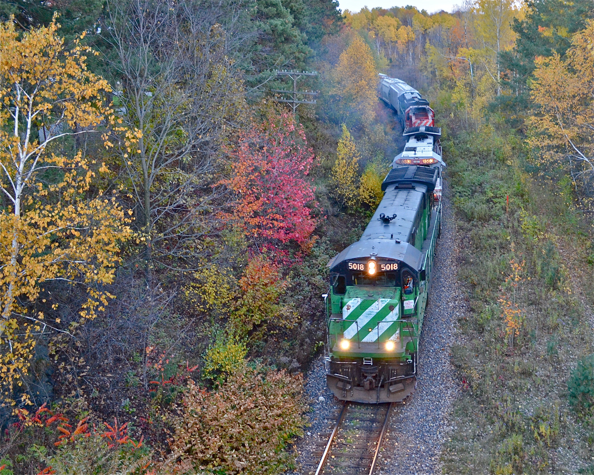 With fall colours at their peak, MMA #1 is westbound through Sherbrooke with an eclectic mix of power just before sunset in 2012. Power is MMA 5018, MMA 8583, leased CP 5833 & MMA 5016. For more train photos, check out http://www.flickr.com/photos/mtlwestrailfan/