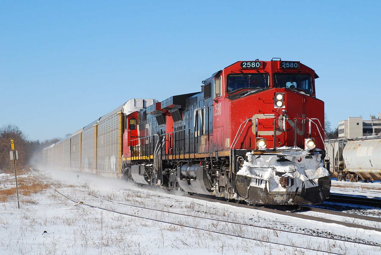 The detector at milepost 27 announced that it was -12, but the bright sun and lack of wind made for a nice day after the storm. CN must have had fun in Chicago yesterday, because this 148 had a whopping one container on it, along with a whole lot of empty wells. I said "this 148" because about four hours earlier the previous day's 148 went through. This winter is taking its toll on CN.