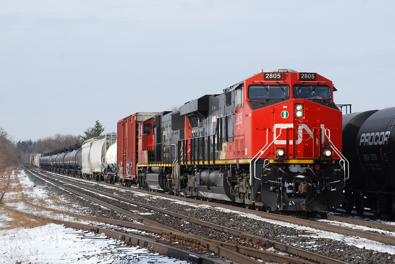 CN 2805 is only a few months old but has already lost its new GEVO shine as it leads 394 through Brantford on the north track.
