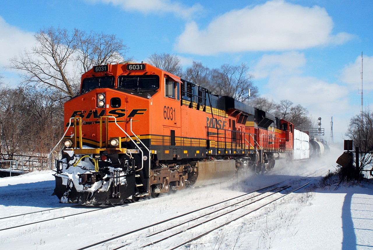I finally managed to catch some of the foreign power that's been running around lately in the form of CN U721 with BNSF 6031 and BNSF 9255 (filled out with mixed freight on the head end of course). Detouring VIA 84 on the south track was at the west of the platform when the photo was taken, so another few seconds later and all I would have gotten was a cloud of snow. Train 393 following 721 also had a pair of BNSF units for power.