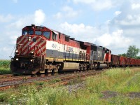 CN 901, the management training train, approaches Power Line Road east of Brantford. The train ran daily from Mac Yard to Paris and return (some times it only went as far as Bayview and turned). BCOL 4642 stayed on the train for quite a while so I don't know why I have a few pictures of it. I have way too many pictures of the train with a pair of 2400's on it. I only managed to catch it once with a pair of 6000's on it.   